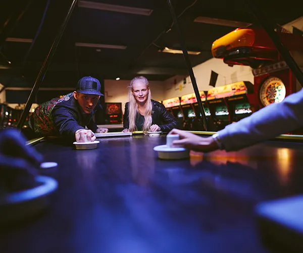 A number of people playing table game for their team building activity